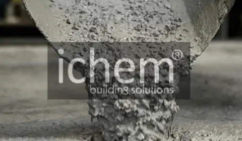 ichem: Superplasticizers for Strong and Fast-Setting Concrete A close-up image of concrete being poured, enhanced with ichem building solutions superplasticizers for early strength development.