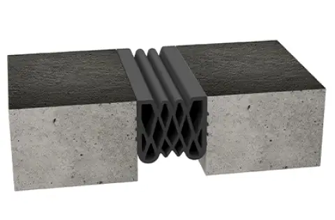 Expantion-joints-Compression-Seals-cs صورة توضح فاصل cs تمدد مطاطي من اي كيم مثبت في فاصل انشائي بين قطعتي خرسانة-from ichem
