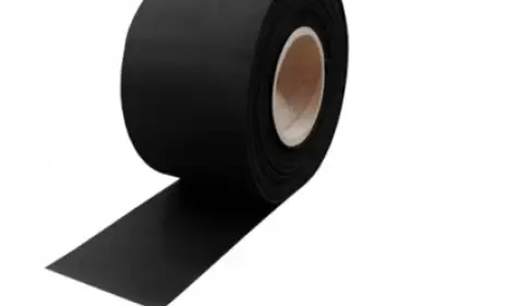 ichem: Integrated Solutions for Moisture Barriers and Building Protection A roll of black moisture barrier tape from ichem building solutions for protecting building foundations مادة عزل قوية