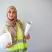 Site Engineer at Construction Project Female site engineer holding construction helmet and project plans